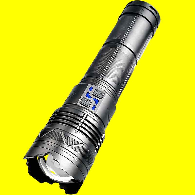 Black tactical flashlight with high-power LED and white laser beam on yellow background